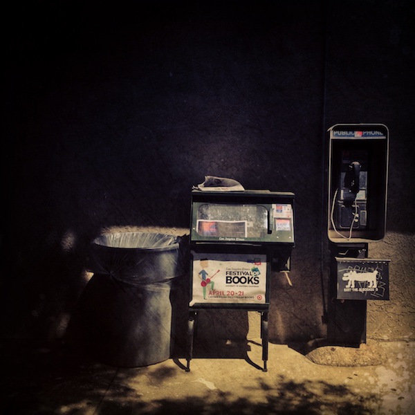 trash can, newspaper stand, pay telephone